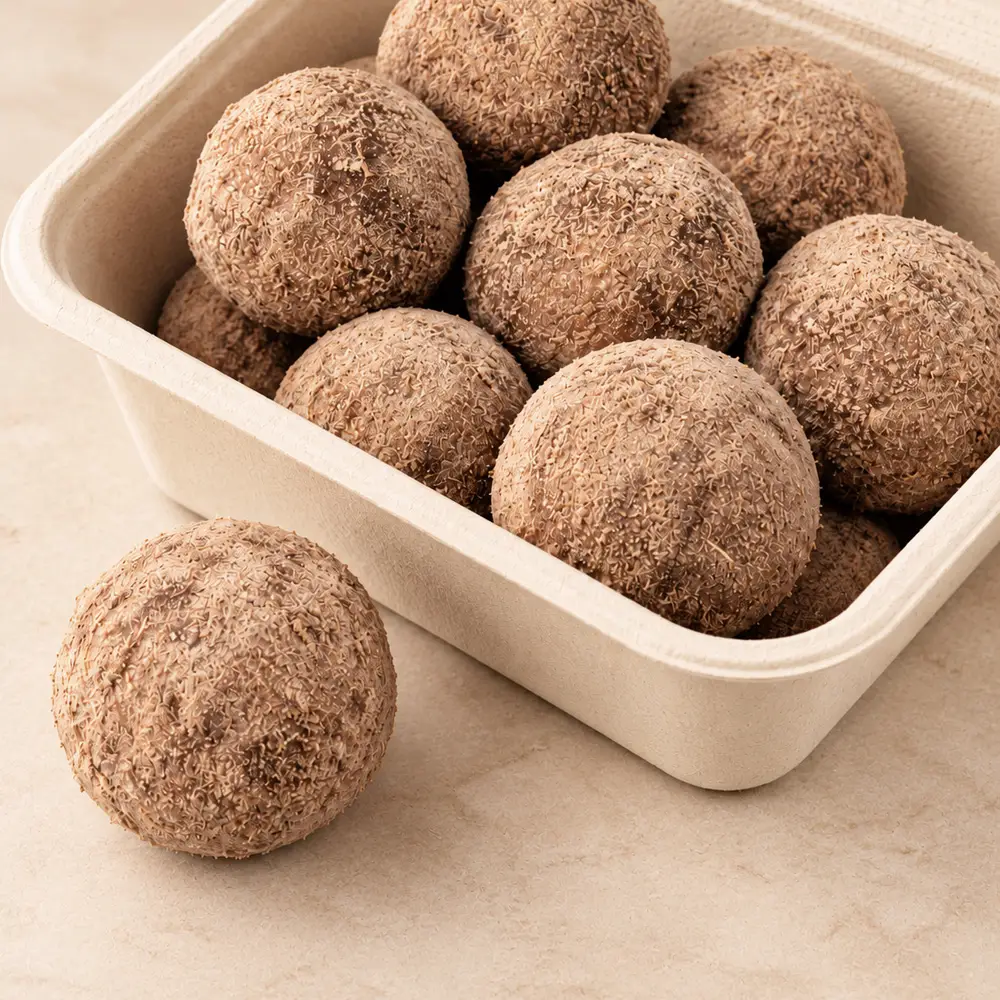 Carb Theory protein balls packed in a plastic-free compostable box for Diwali gifting